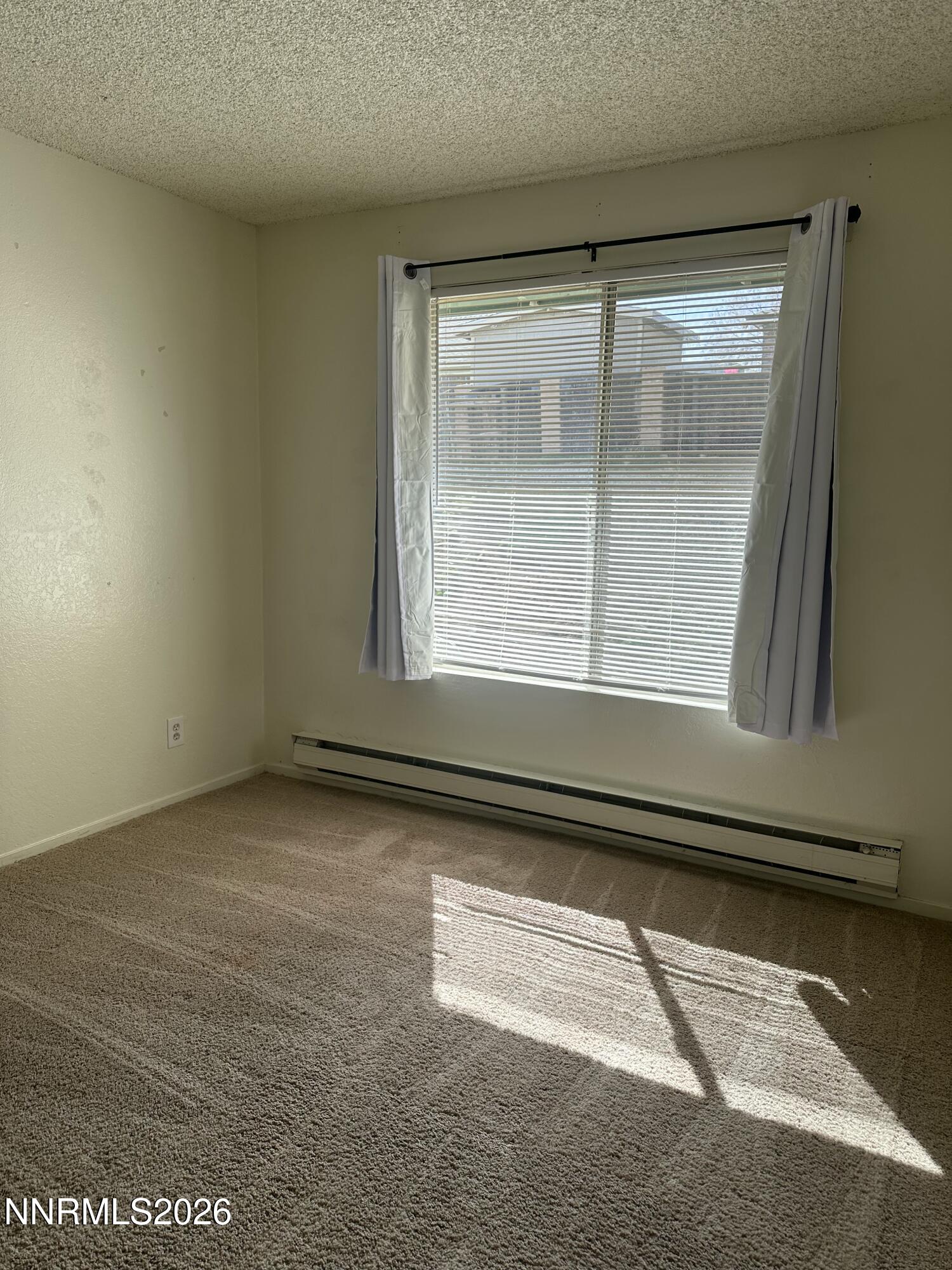 3928 Clear Acre Lane, Unit 116 Reno, NV 89512 - Photo 8 of 12 a view of a window in an empty room