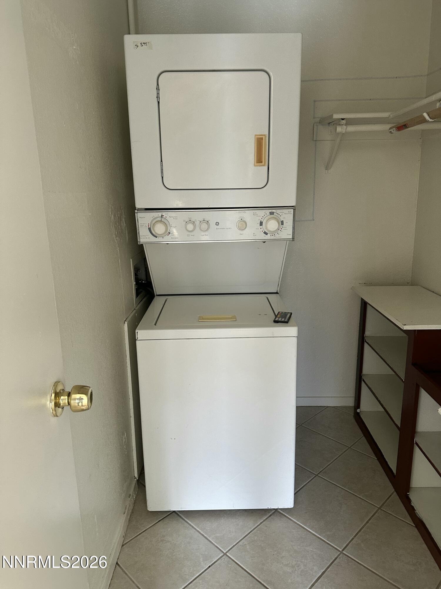 3928 Clear Acre Lane, Unit 116 Reno, NV 89512 - Photo 10 of 12 a utility room with dryer and washer