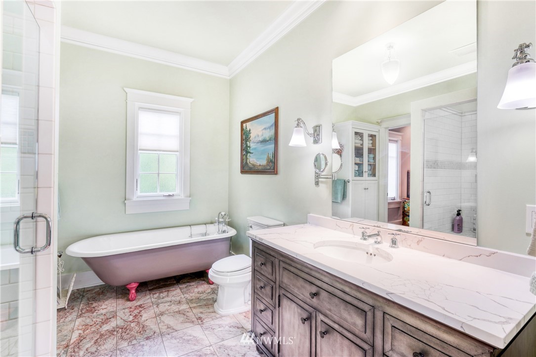 415 5th Street Anacortes, WA 98221 - Photo 16 of 38 a bathroom with a granite countertop sink and a mirror