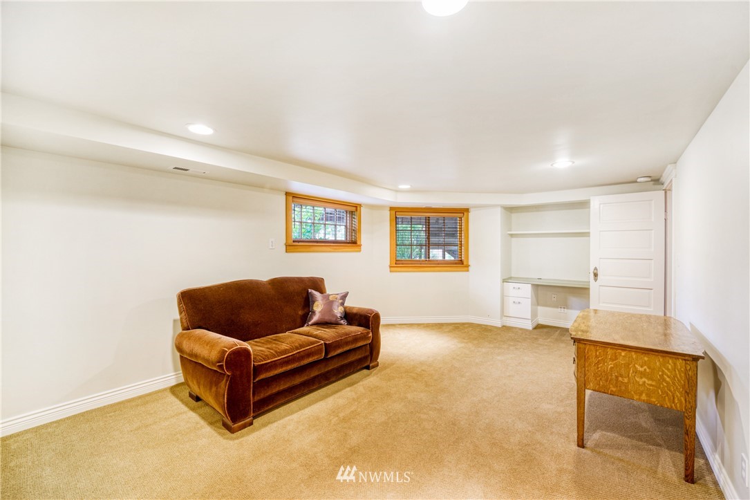 415 5th Street Anacortes, WA 98221 - Photo 25 of 38 a living room with furniture and a couch