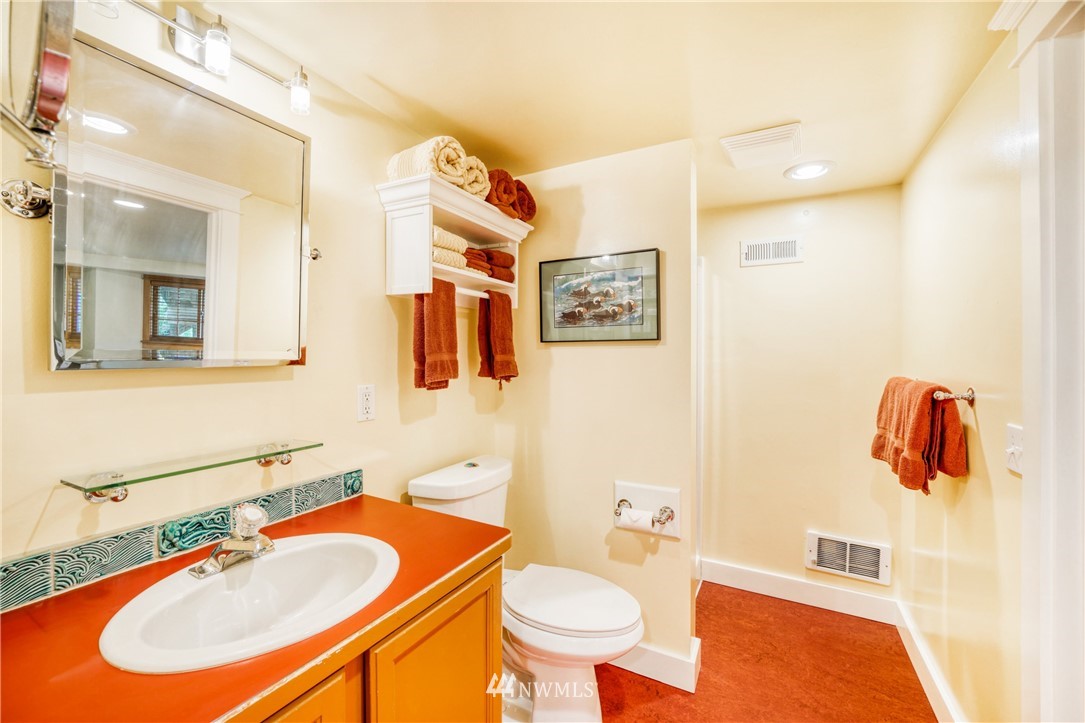 415 5th Street Anacortes, WA 98221 - Photo 26 of 38 a bathroom with a sink and a mirror