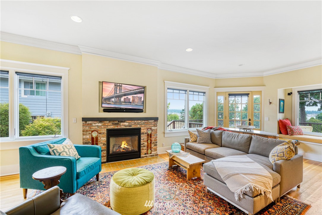 415 5th Street Anacortes, WA 98221 - Photo 5 of 38 a living room with furniture fireplace and a large window