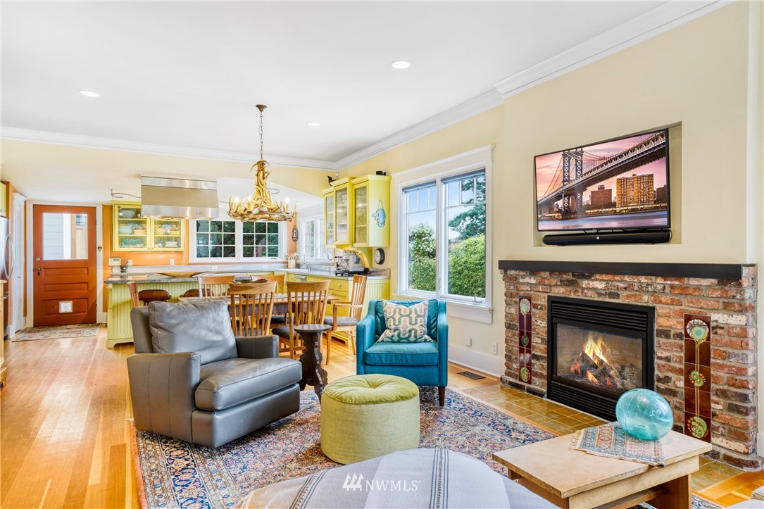 415 5th Street Anacortes, WA 98221 - Photo 6 of 38 a living room with furniture fireplace and a large window