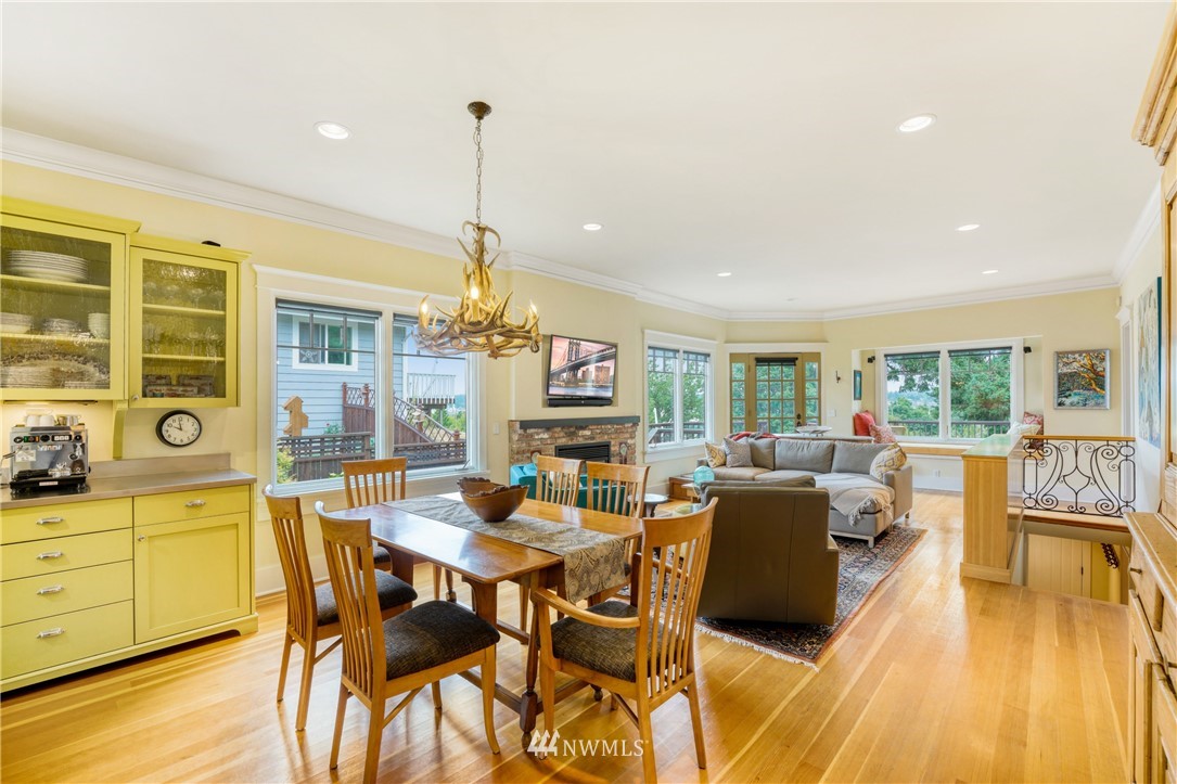 415 5th Street Anacortes, WA 98221 - Photo 7 of 38 a view of a dining room with furniture window and wooden floor