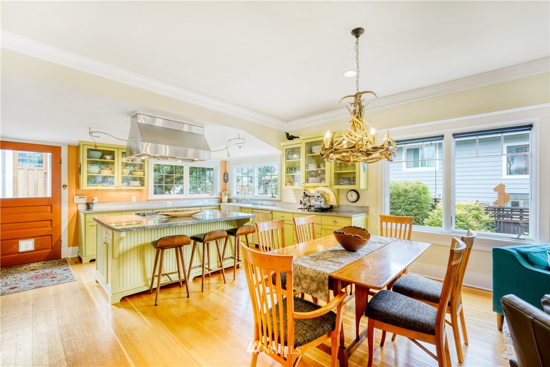 415 5th Street Anacortes, WA 98221 - Photo 8 of 38 a dining room with furniture a chandelier and wooden floor