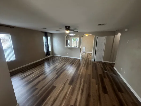 a view of kitchen with wooden floor and a sink