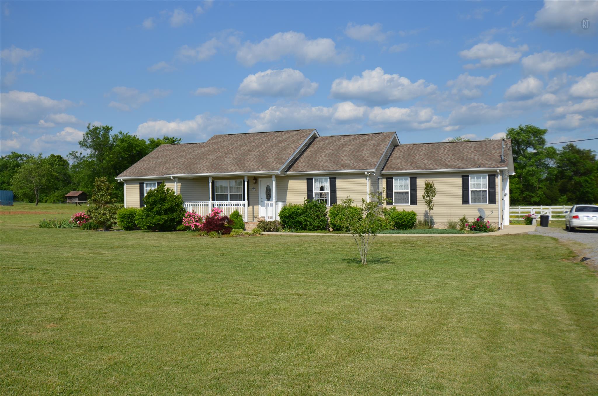 142 County Line Road Bell Buckle, TN 37020 - Photo 1 of 11 a front view of a house with a yard