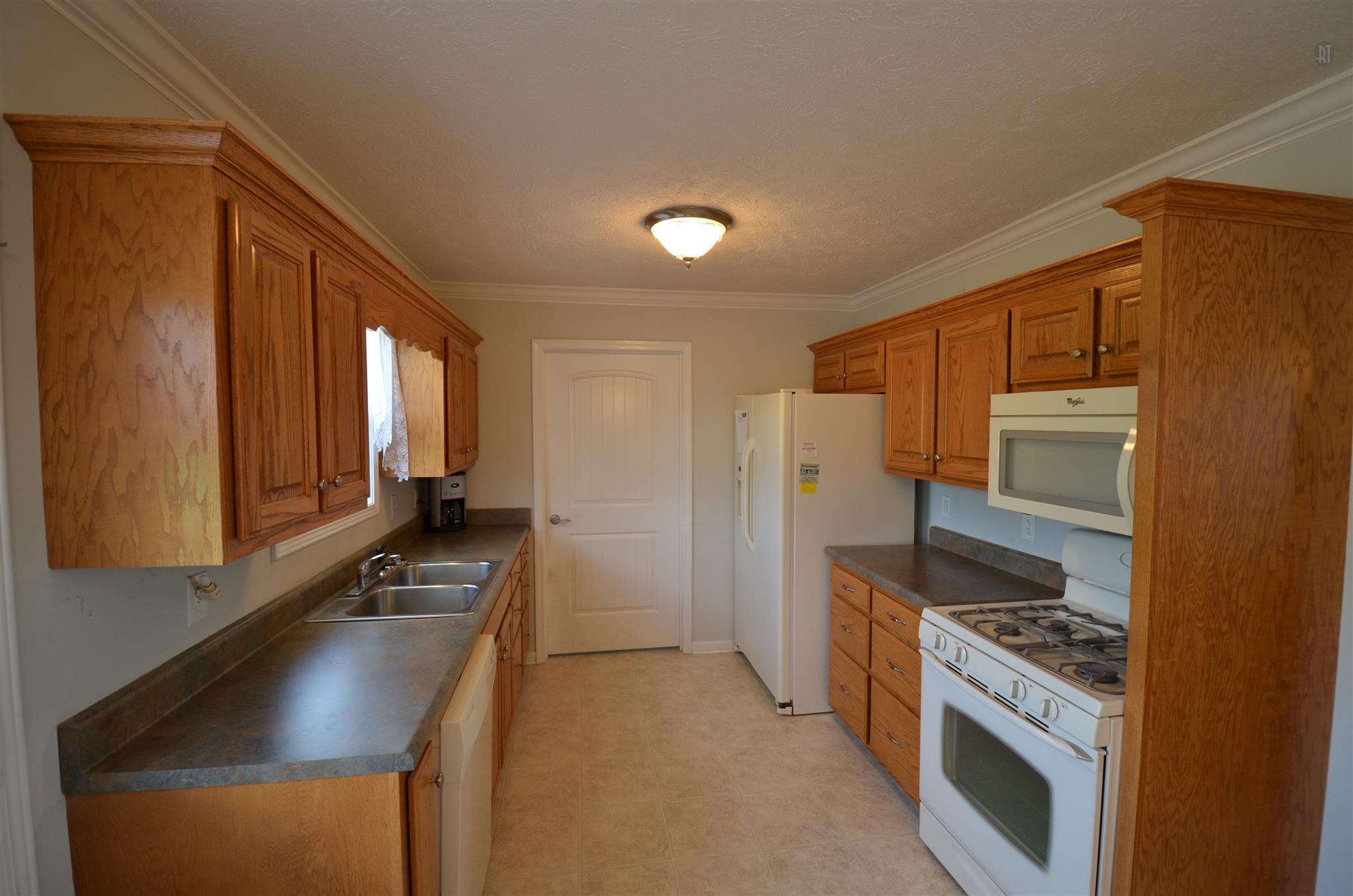 142 County Line Road Bell Buckle, TN 37020 - Photo 8 of 11 a kitchen with a refrigerator and a stove top oven