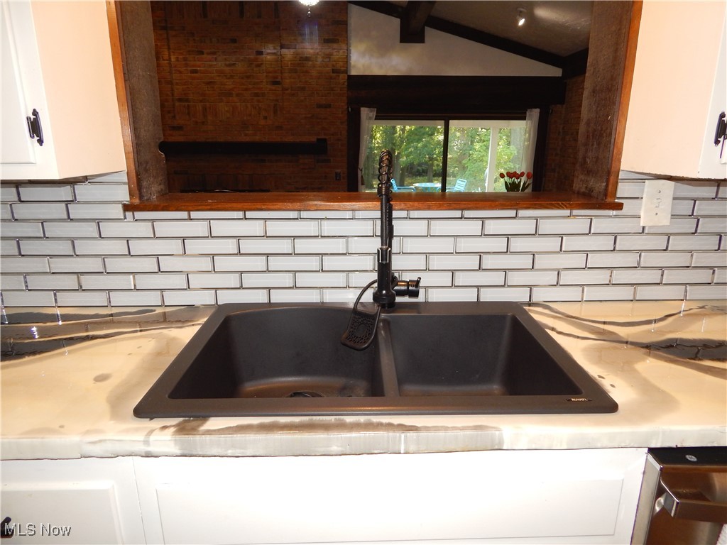 2128 Miami Road Euclid, OH 44117 - Photo 14 of 36 Details with white cabinets, decorative backsplash