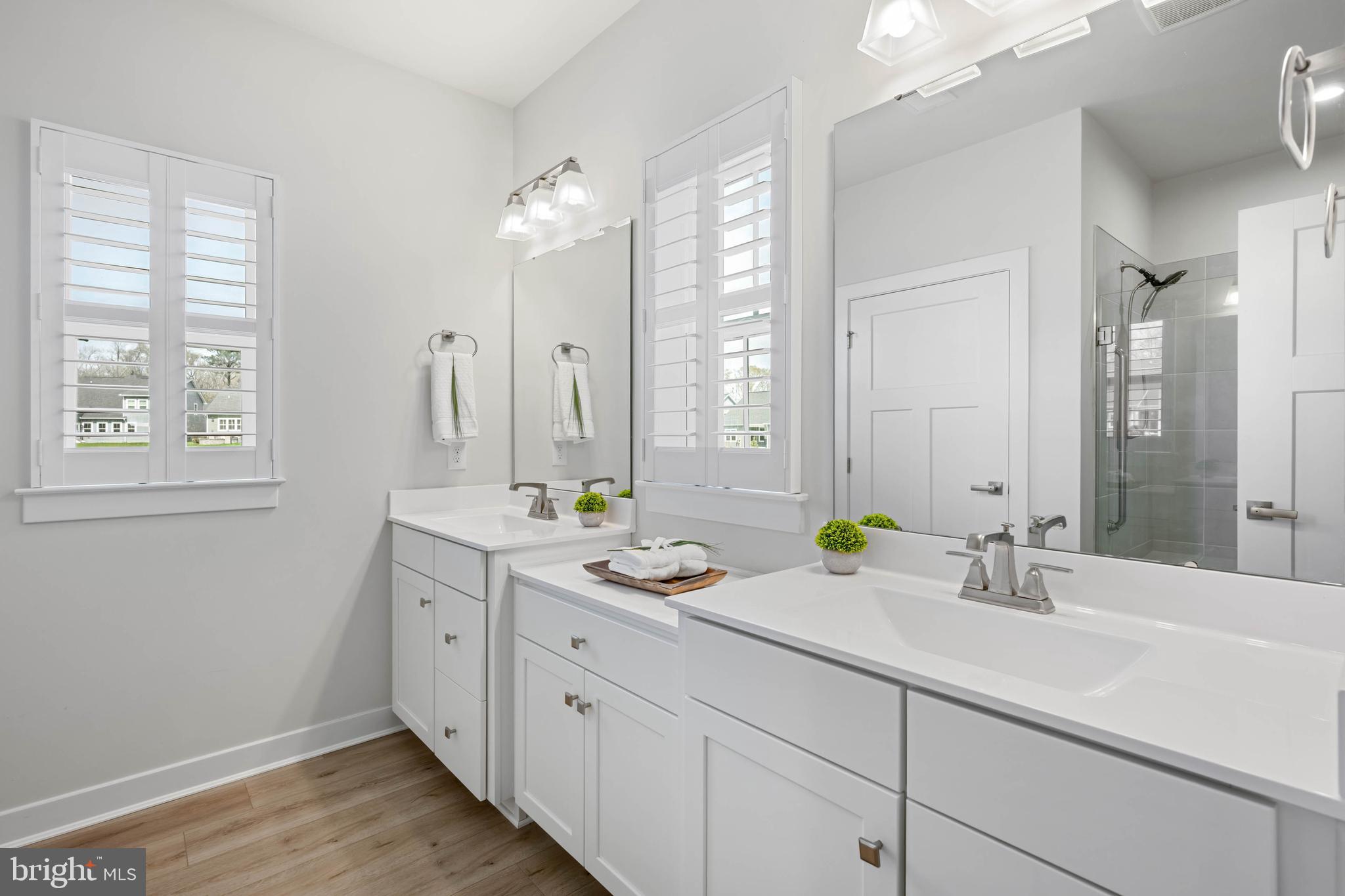 37689 Wildwood Lane Dagsboro, DE 19939 - Photo 21 of 43 a bathroom with double sink and a window