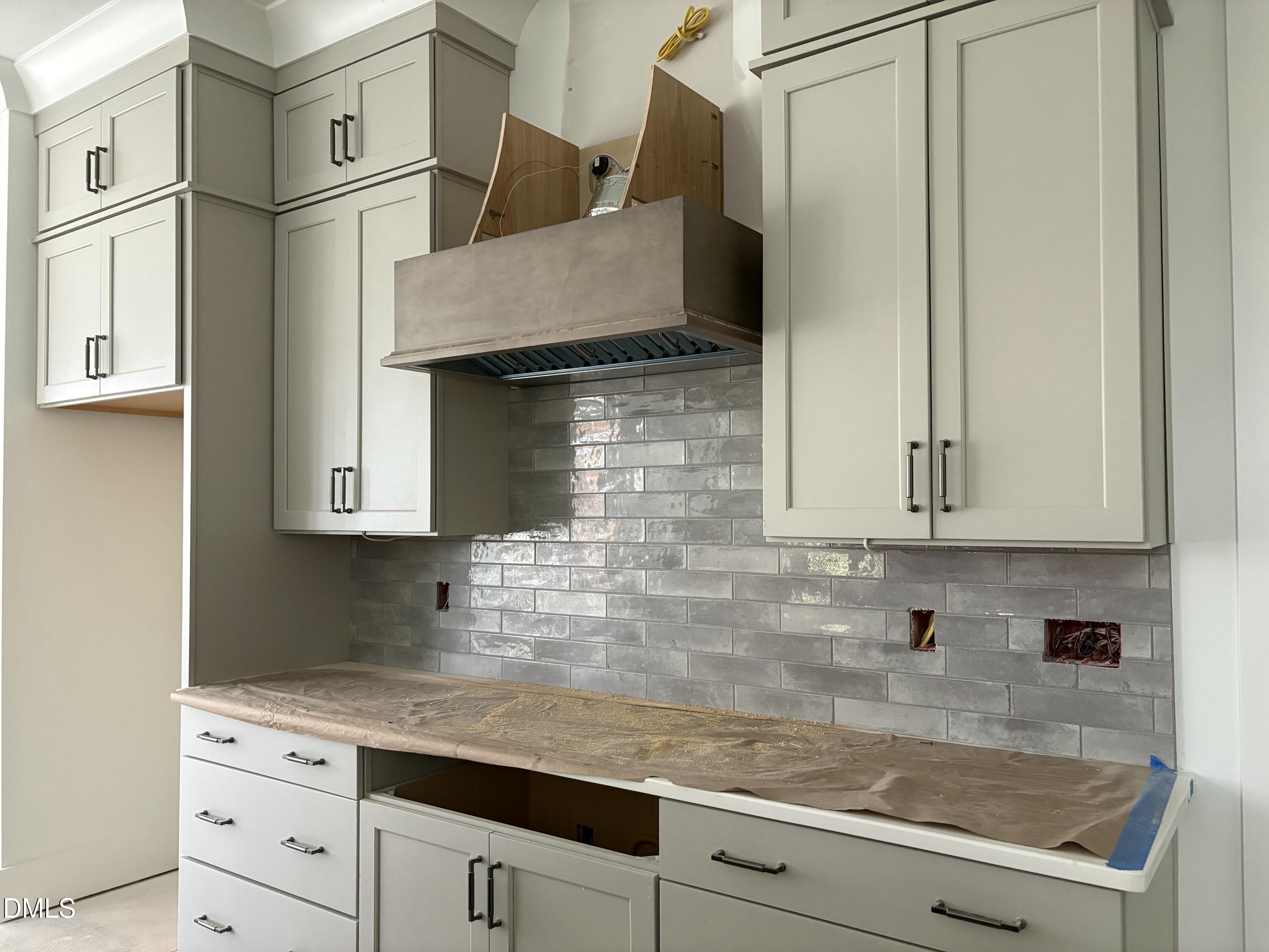 191 High Ridge Lane Pittsboro, NC 27312 - Photo 2 of 54 a kitchen with granite countertop a sink a stove and cabinets