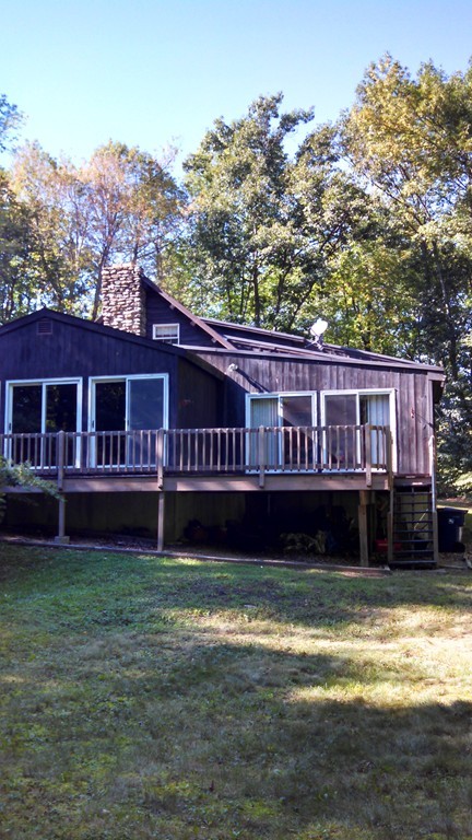 28 Knower Road Westminster, MA 01473 - Photo 3 of 18 a view of a house with a wooden deck and a big yard