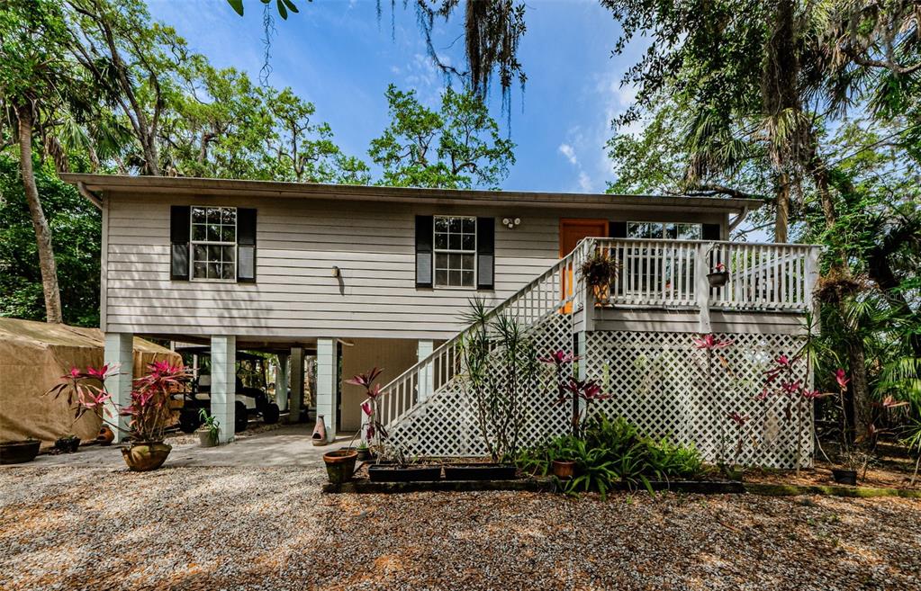 8523 Green Street Port Richey, FL 34668 - Photo 1 of 1 an outdoor view of a house with a garden