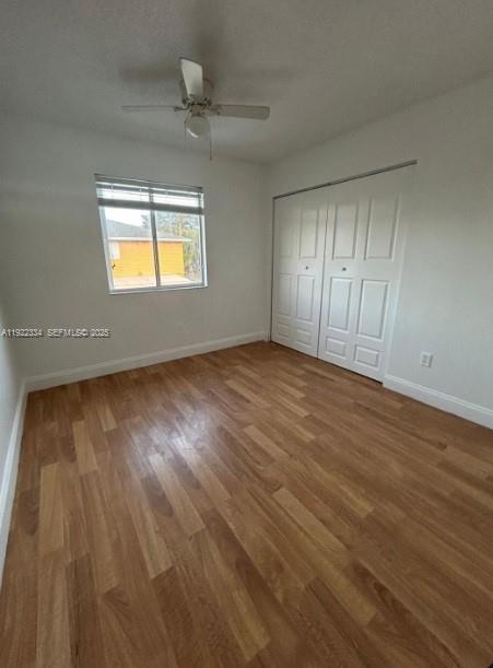 35 Northeast 12th Avenue, Unit 35 Homestead, FL 33030 - Photo 15 of 22 wooden floor in an empty room with a window