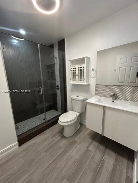 35 Northeast 12th Avenue, Unit 35 Homestead, FL 33030 - Photo 16 of 22 a bathroom with a sink mirror toilet and shower