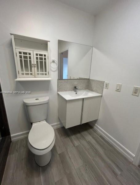 35 Northeast 12th Avenue, Unit 35 Homestead, FL 33030 - Photo 17 of 22 a bathroom with a toilet a sink and mirror