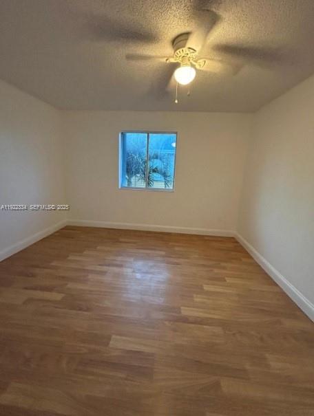 35 Northeast 12th Avenue, Unit 35 Homestead, FL 33030 - Photo 18 of 22 a view of room with fan and hardwood floor