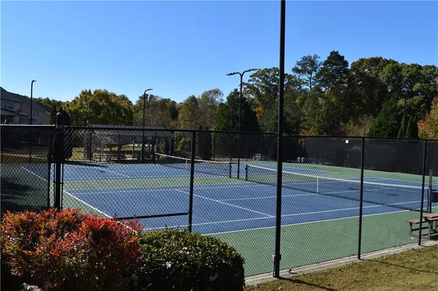 a view of a wooden deck with a yard