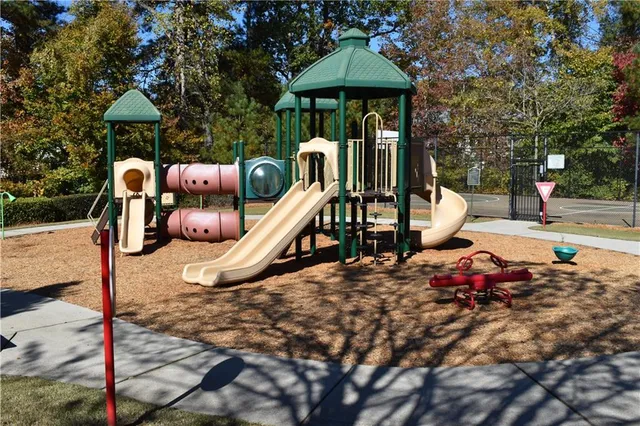 a view of a wooden deck and a yard