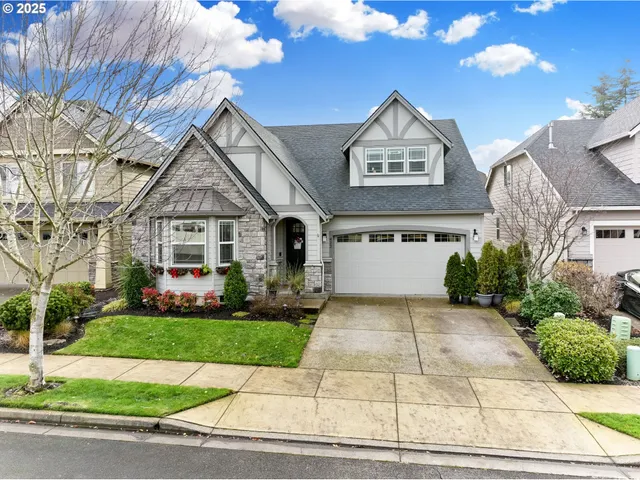 a front view of a house with garden