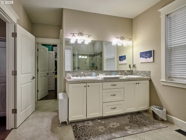 a bathroom with a sink and a shower
