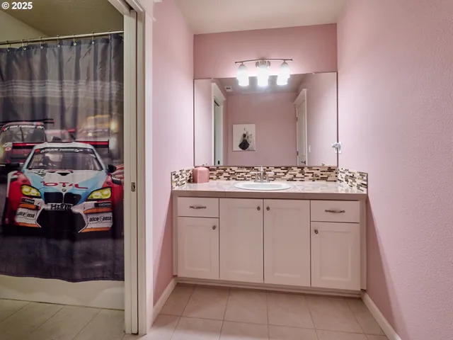 a spacious bathroom with a double vanity sink mirror and