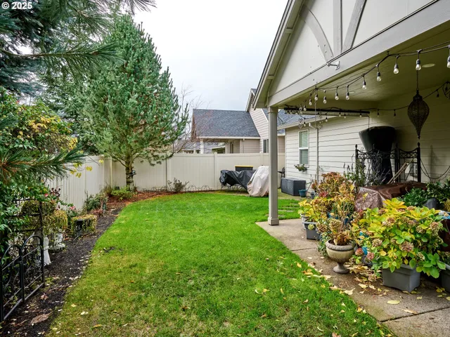 a view of house with backyard