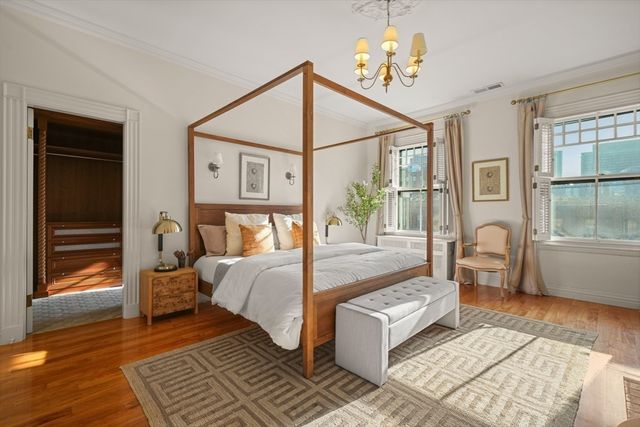 a bedroom with bed and window