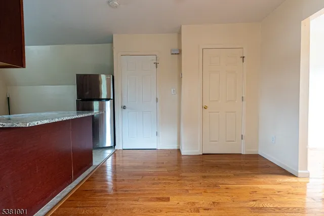 a view of kitchen space with wooden floor