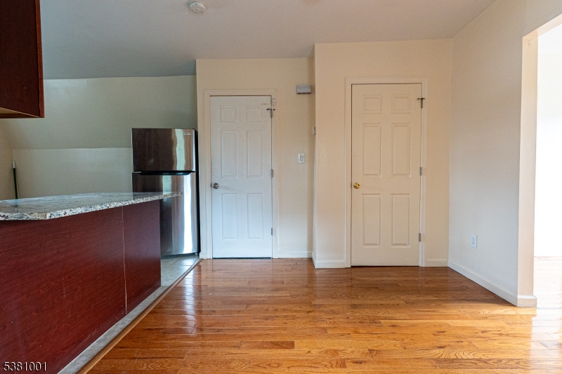 873 South 19th Street, Unit 3 Newark, NJ 07108 - Photo 2 of 10 a view of kitchen space with wooden floor