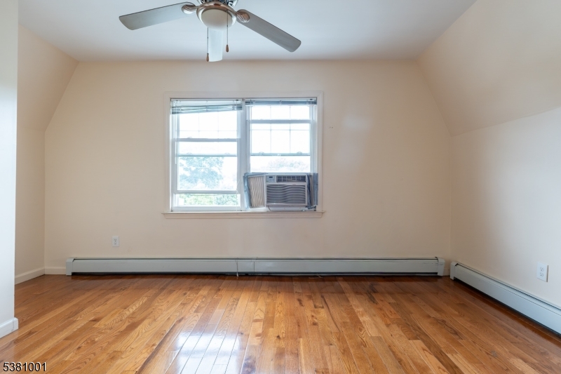 873 South 19th Street, Unit 3 Newark, NJ 07108 - Photo 7 of 10 an empty room with a window
