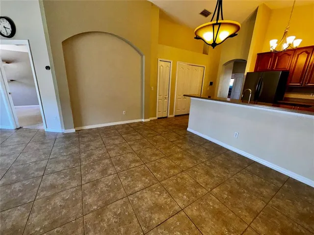 a view of a livingroom with furniture and a chandelier