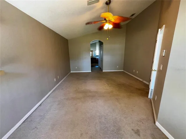 wooden floor in an empty room with a mirror