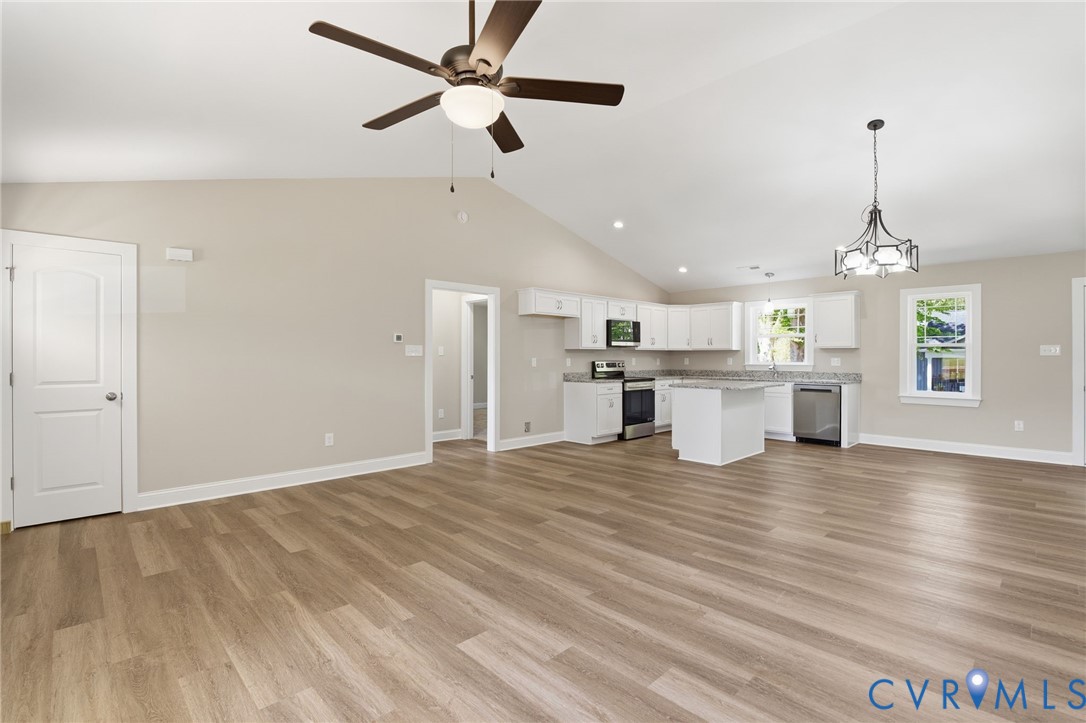 17557 Hewlett Road Beaverdam, VA 23015 - Photo 6 of 29 a view of a kitchen with a stove cabinets and wooden floor