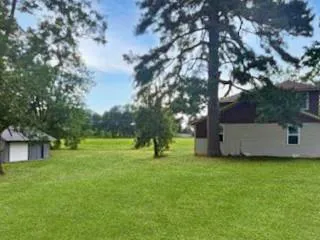 a view of a house with a big yard
