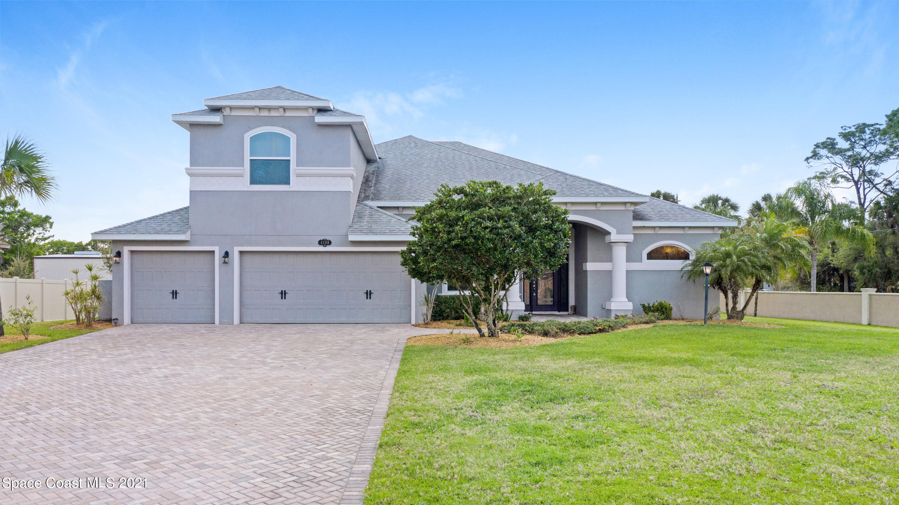 4108 Anlow Road Melbourne, FL 32904 - Photo 3 of 56 a view of a house with a yard
