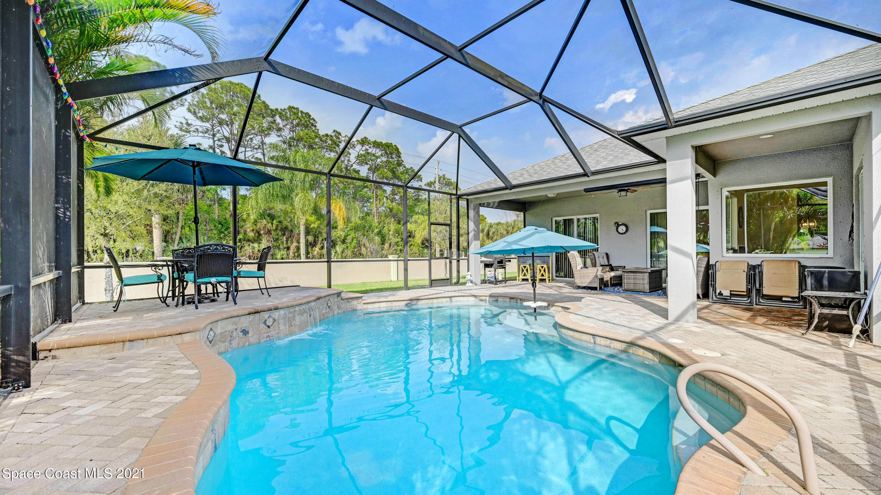 4108 Anlow Road Melbourne, FL 32904 - Photo 22 of 56 a view of a swimming pool with a patio