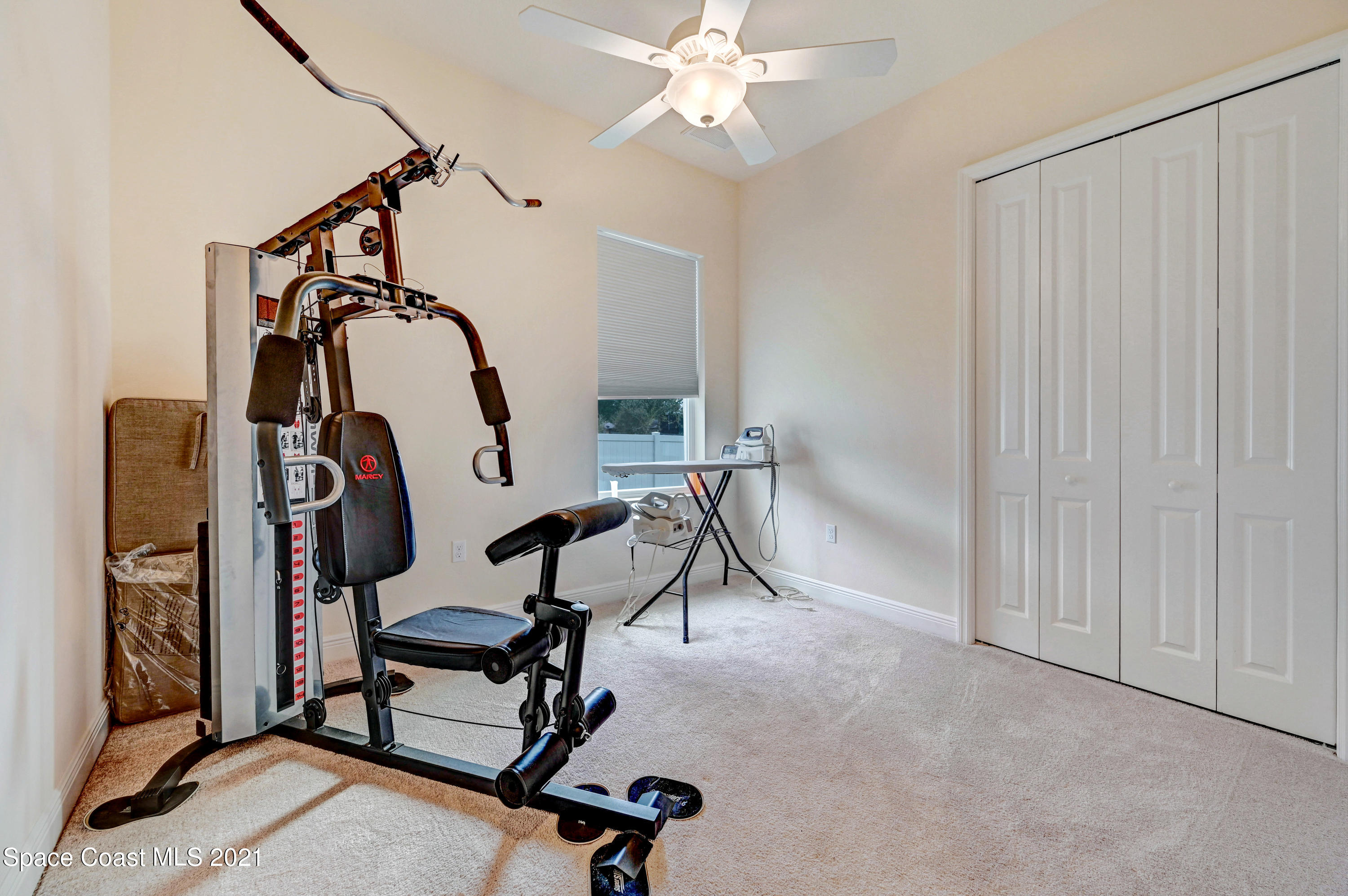 4108 Anlow Road Melbourne, FL 32904 - Photo 50 of 56 a view of a room with gym equipment