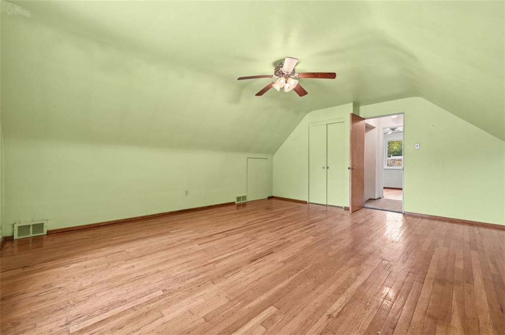 328 Ruthwood Avenue Pittsburgh, PA 15227 - Photo 19 of 32 a view of a room with wooden floor and a ceiling fan