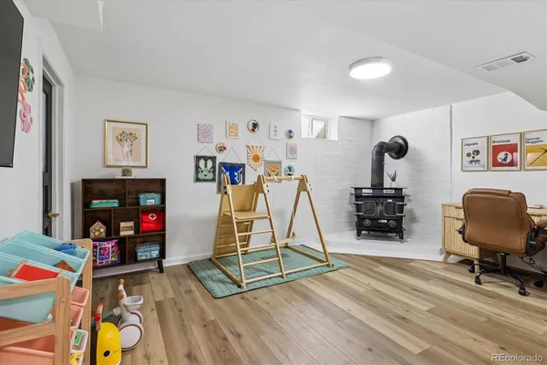 a view of a workspace with furniture and a gym
