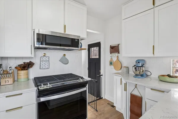 a kitchen with a stove and a microwave