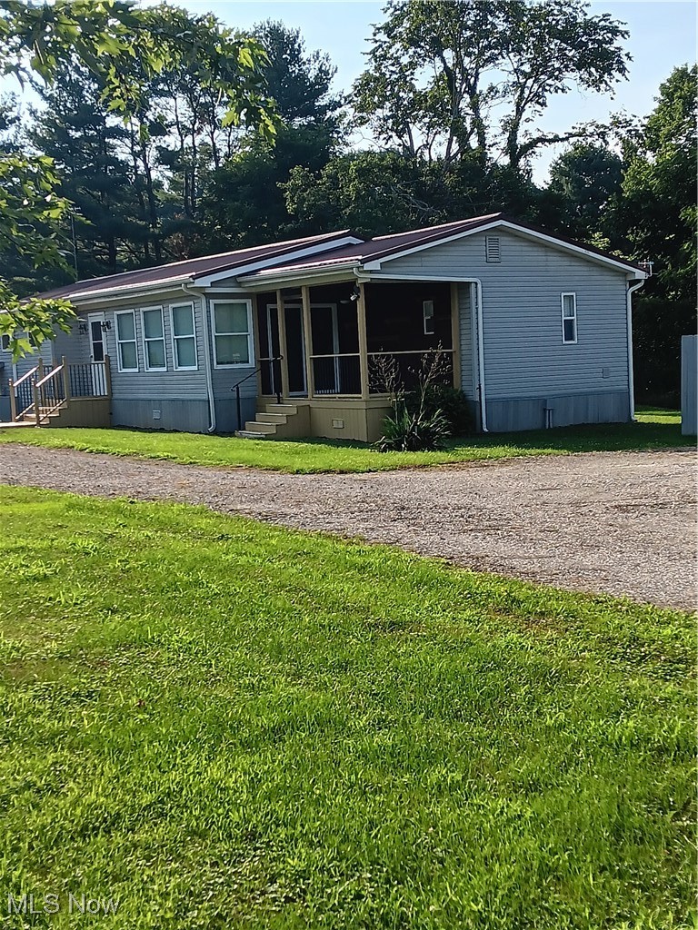 76241 Old Twenty One Road Kimbolton, OH 43749 - Photo 3 of 36 Manufactured / mobile home with a front yard