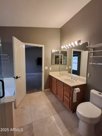 a view of an empty room with a ceiling fan