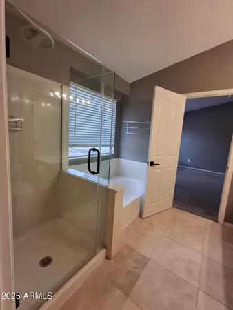 a view of room with a ceiling fan and window
