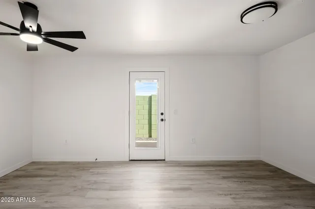 a view of an empty room with a window