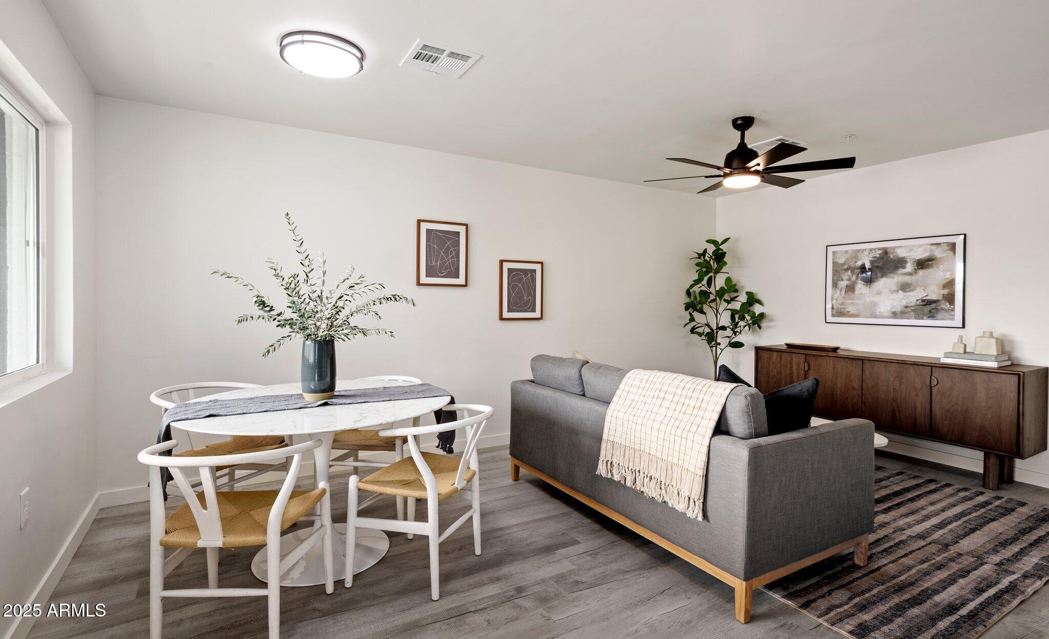 3114 North 68th Street, Unit 3 Scottsdale, AZ 85251 - Photo 4 of 25 a view of a livingroom with furniture and wooden floor