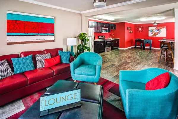 a living room with furniture and a rug