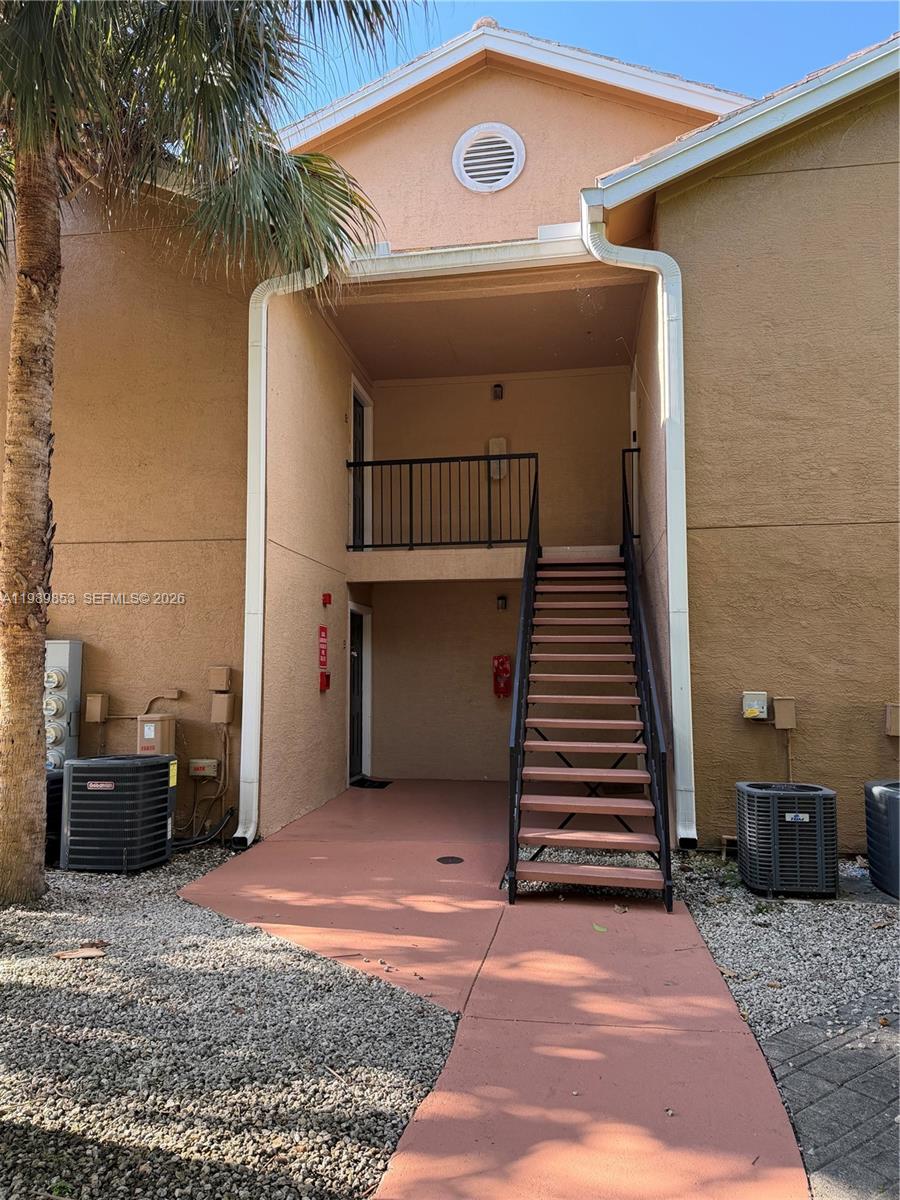 10670 Southwest 156th Place, Unit 308 Miami, FL 33196 - Photo 13 of 21 a view of a house with a stairs