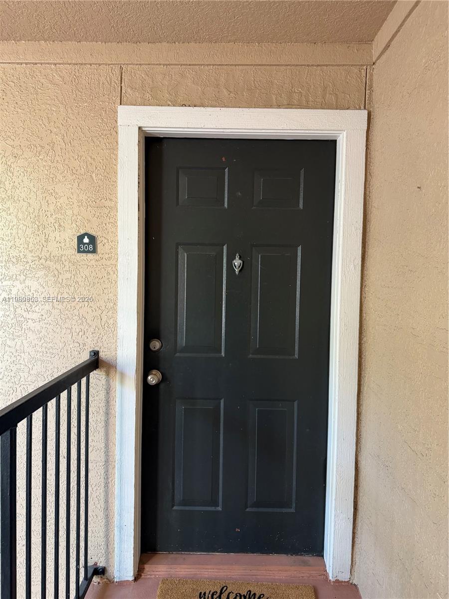 10670 Southwest 156th Place, Unit 308 Miami, FL 33196 - Photo 14 of 21 a view of front door