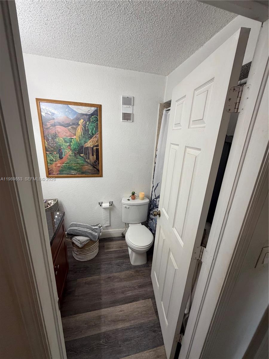 10670 Southwest 156th Place, Unit 308 Miami, FL 33196 - Photo 6 of 21 a view of a bathroom with a sink and a mirror
